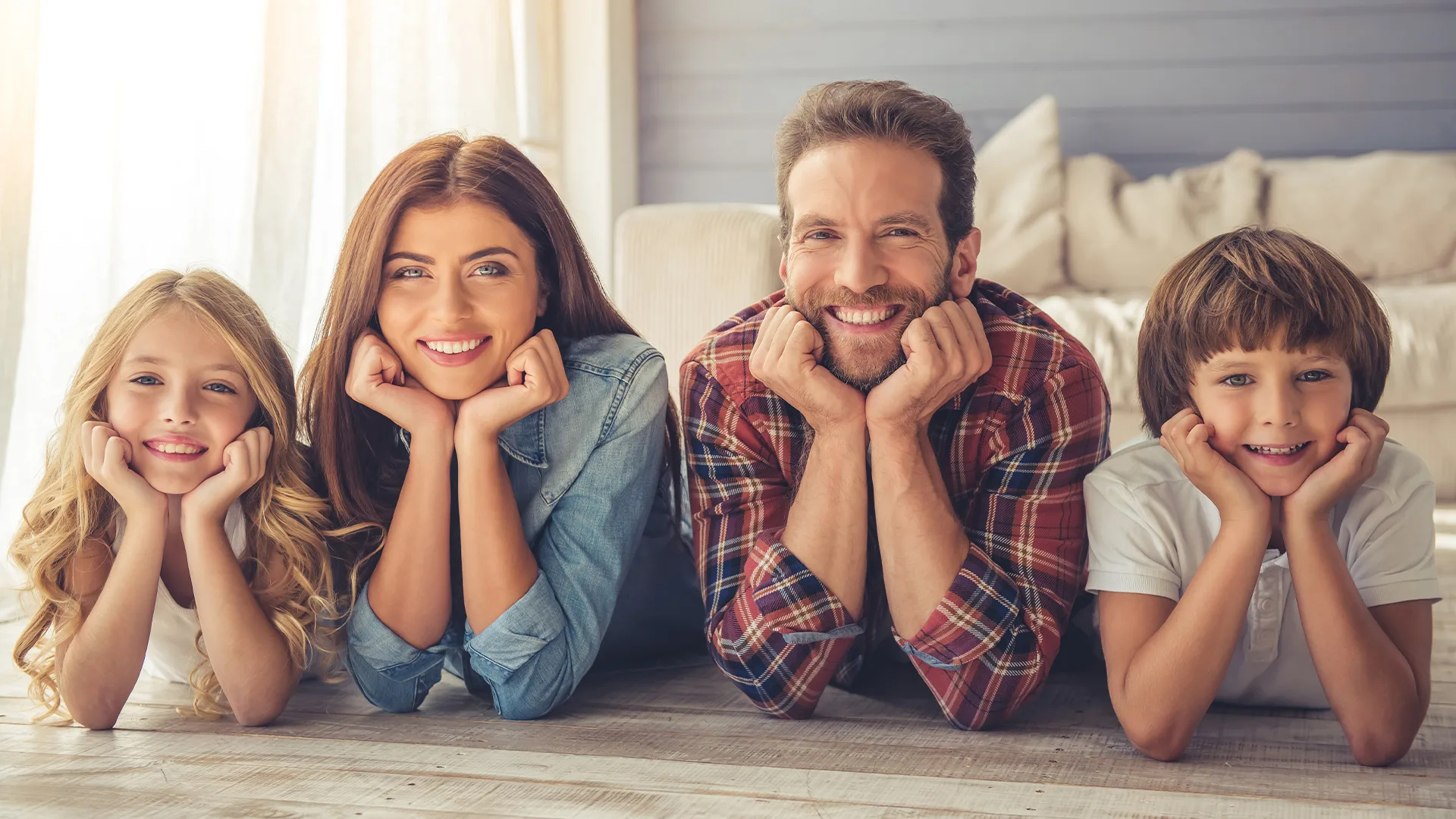 Happy family smiling at Reform Dentistry in Fredericksburg and Spotsylvania, VA